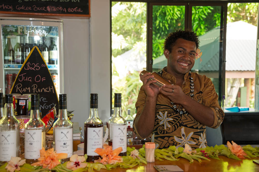 Friendly smiling bartender at Waidroka Bay Resort