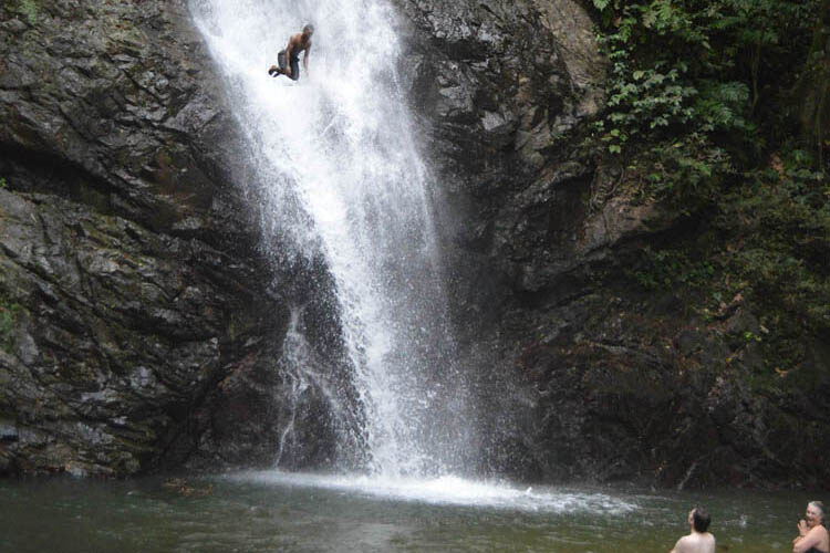 Man jumping down a waterfall