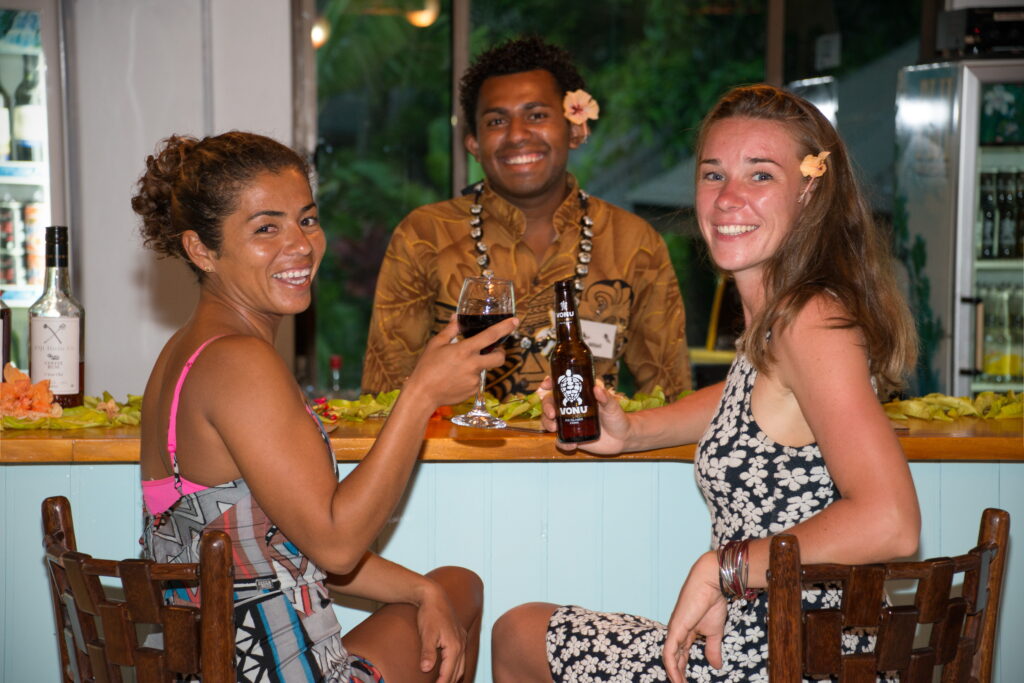 Friendly bartender and guests