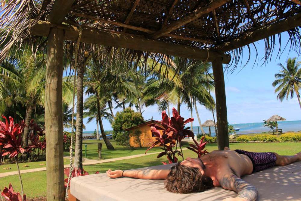 Man relaxing on an outdoor swing
