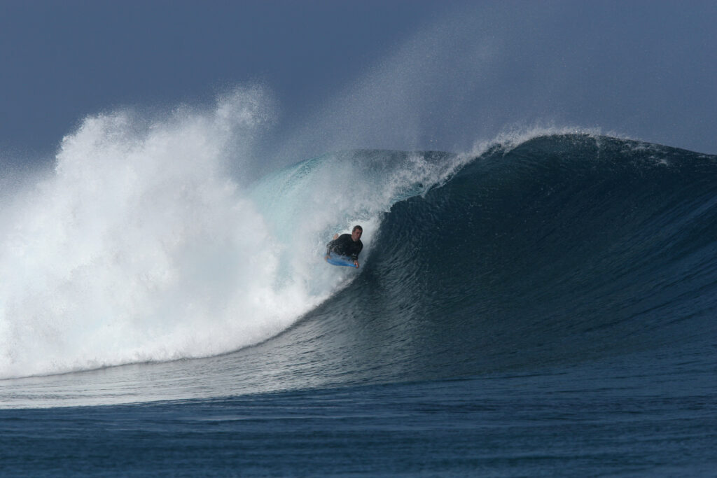 Bodyboarder on wave at Pipe