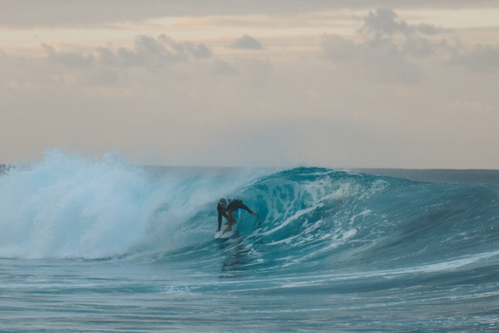 Surfing a beautiful tubular wave
