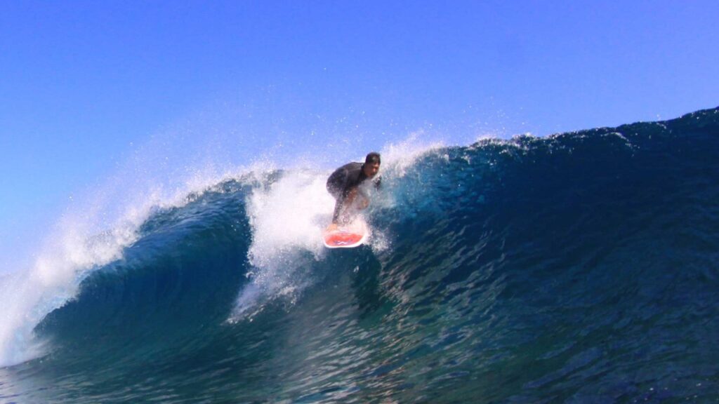 photo of surfer riding wave at 420's