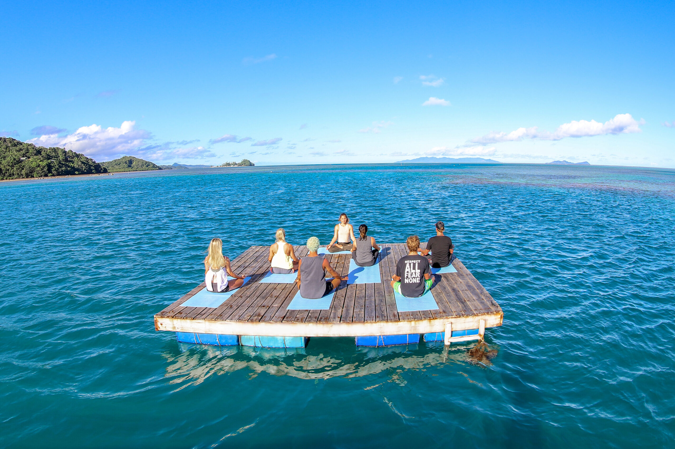 Yoga on the floating pontoon at Waidroka Bay Resort
