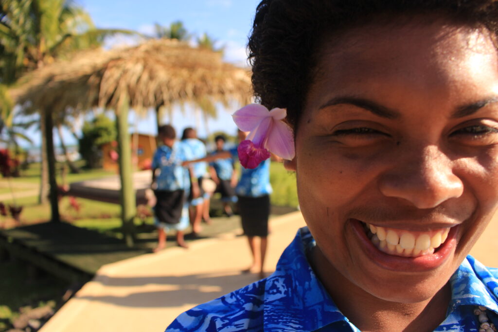 Smiling female staff at Waidroka Bay Resort