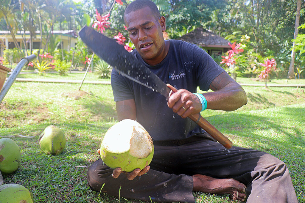 Waidroka demonstration on opening a coconut