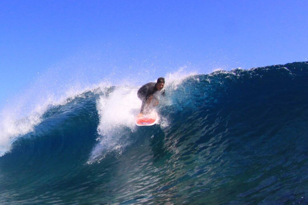 photo of surfer riding wave at 420's